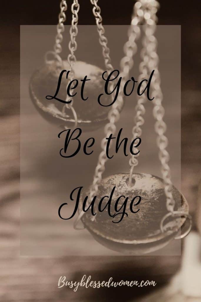 let God be the judge- scales of justice on brown table
