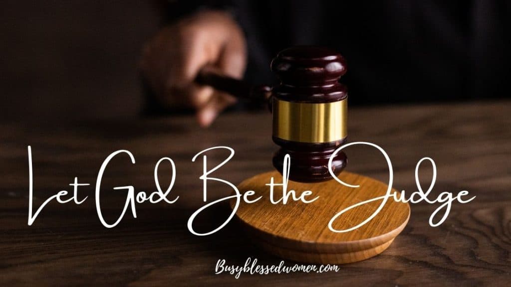 let God be the judge- hand with gavel pounding on wood