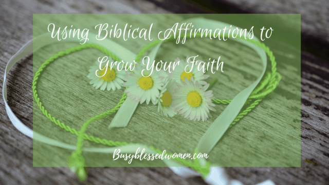 Biblical Affirmations- daisy garland on a wood background with green ribbon