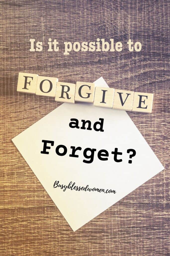 Forgive and Forget- post it note on wooden table with the word "forgive" in scrabble blocks