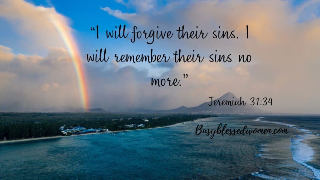 forgive and forget- story sky with rainbow over ocean shore