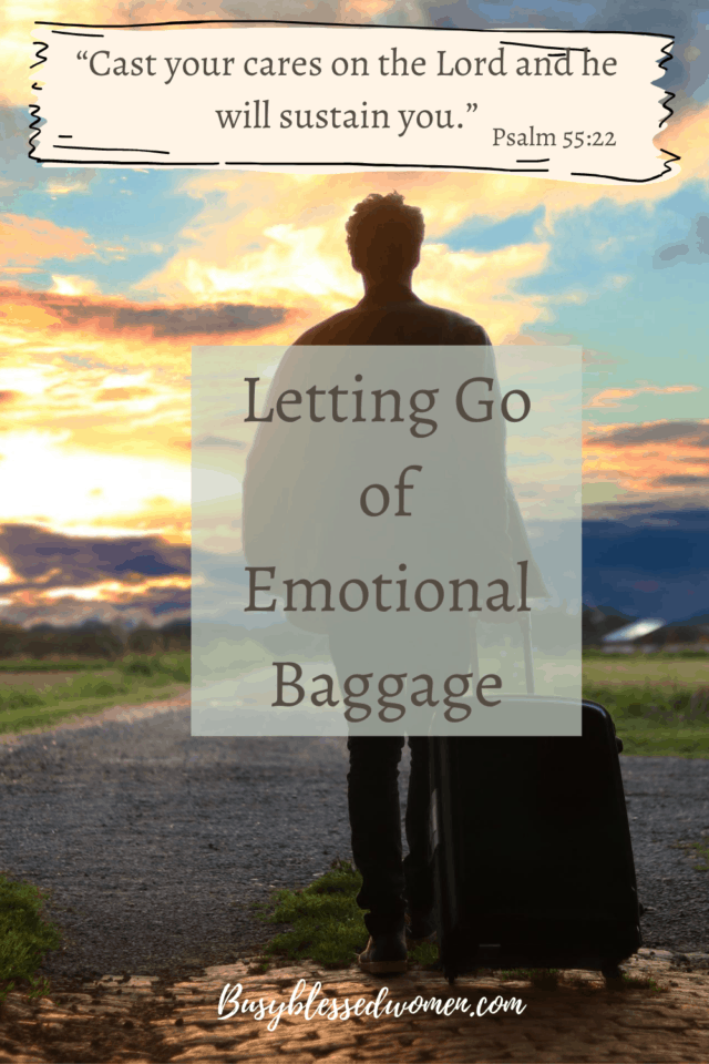 Letting Go of Emotional Baggage- Man with luggage from behind facing sunset