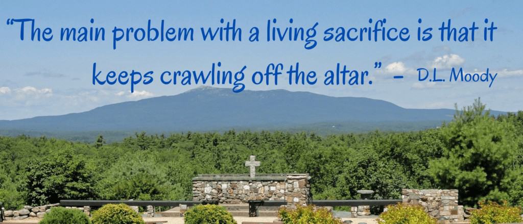 stone altar with simple cross - outside with view of mountain