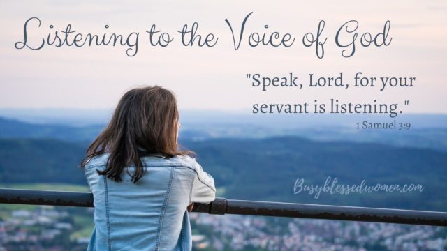 Listening to the voice of God- photo of back of girl in light blue denim jacket resting arms on railing, looking out over city/hills below