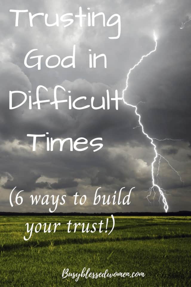 Trusting God in Difficult Times- Single lightning bolt coming from a dark, stormy sky, hitting a green field