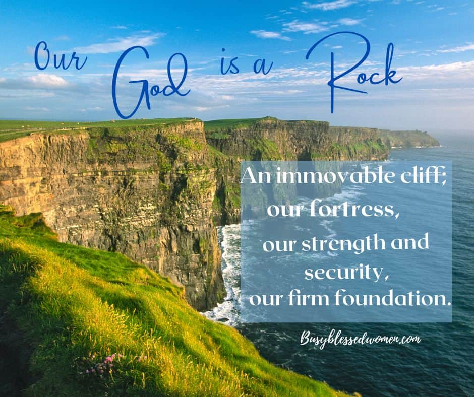Our God is a rock- photo of massive rocky cliff shoreline overlooking blue sea