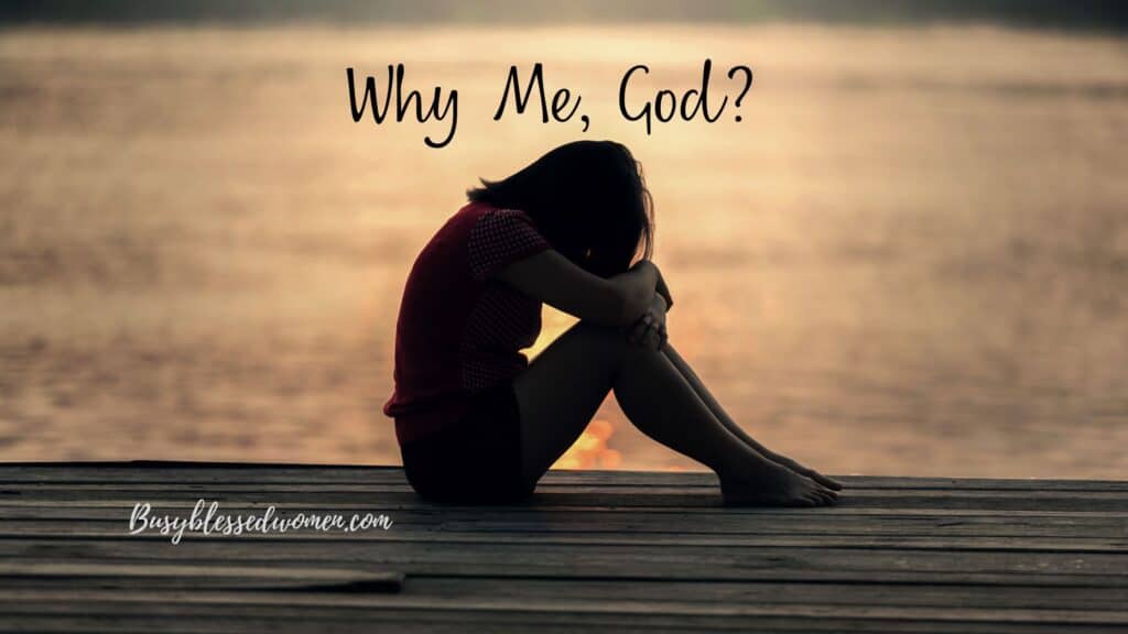 Girl in shorts and tshirt, sitting on dock with head on knees, in silhouette, on dock overlooking sepia tone water'
 