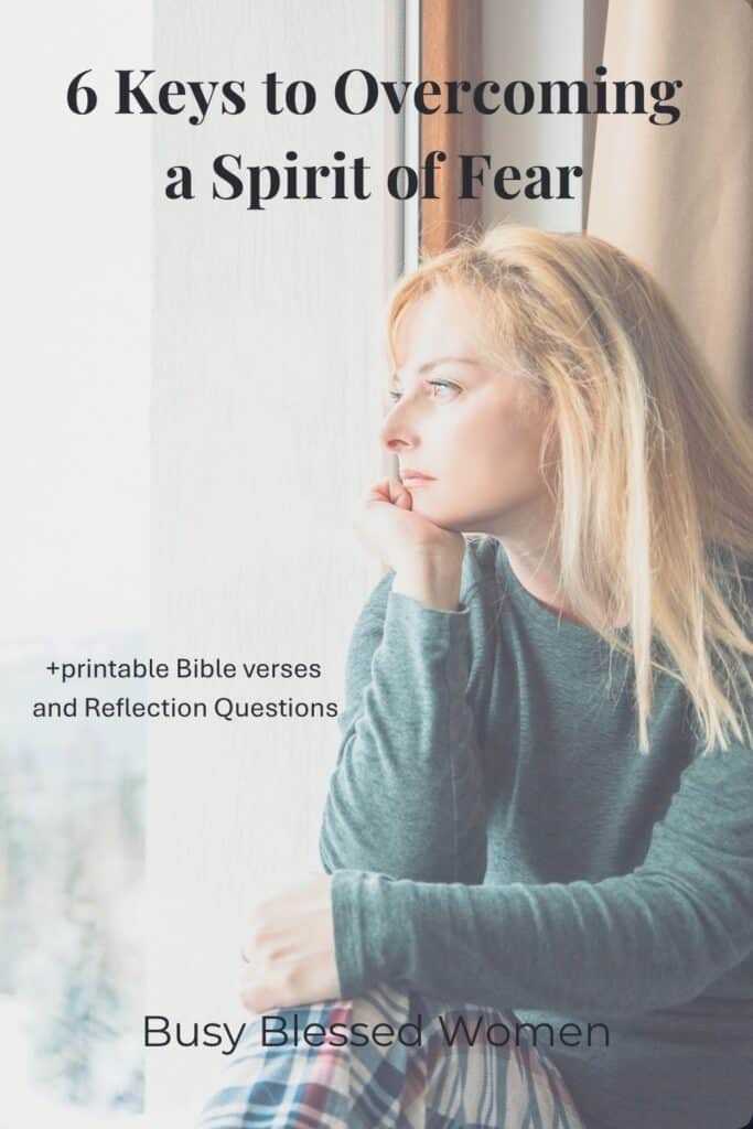 Overcoming a Spirit of Fear- pensive woman looking out window- blond, wearing blue sweater and plaid slacks