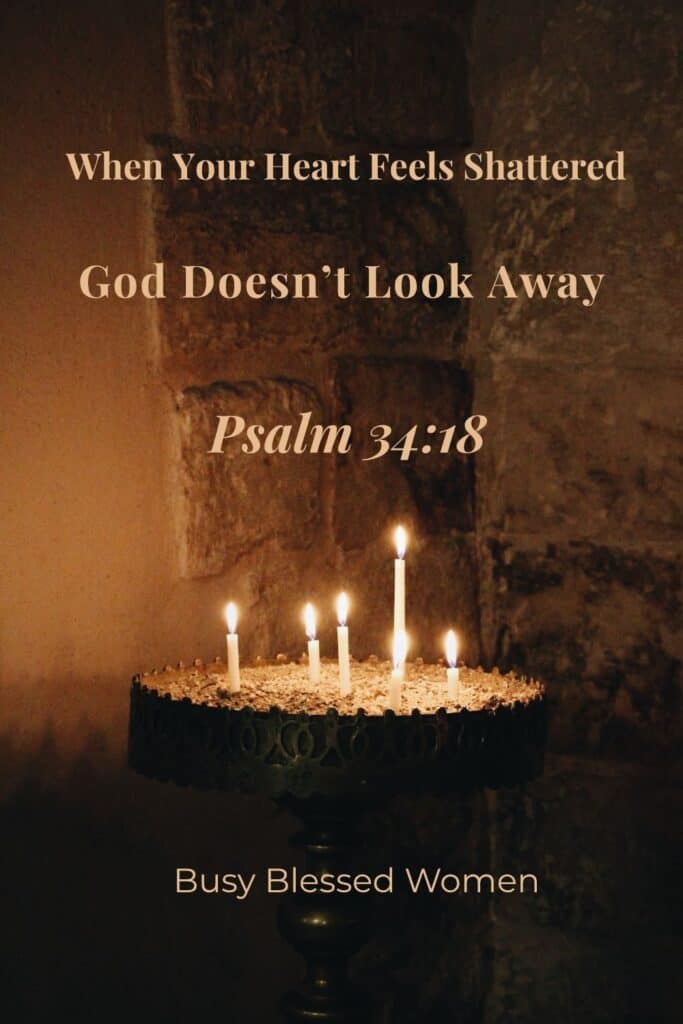 Psalm 34:18- dark stone wall area with ornate candle stand with 4 lit candles