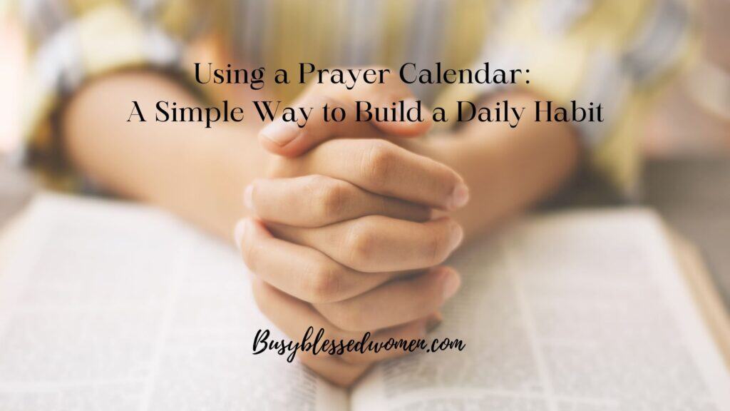 monthly prayer calendar- close photo of woman's hands in prayer on top of a Bible