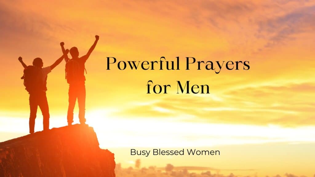 Prayers for Men- 2 men standing on mountain with arms upward against orange sky