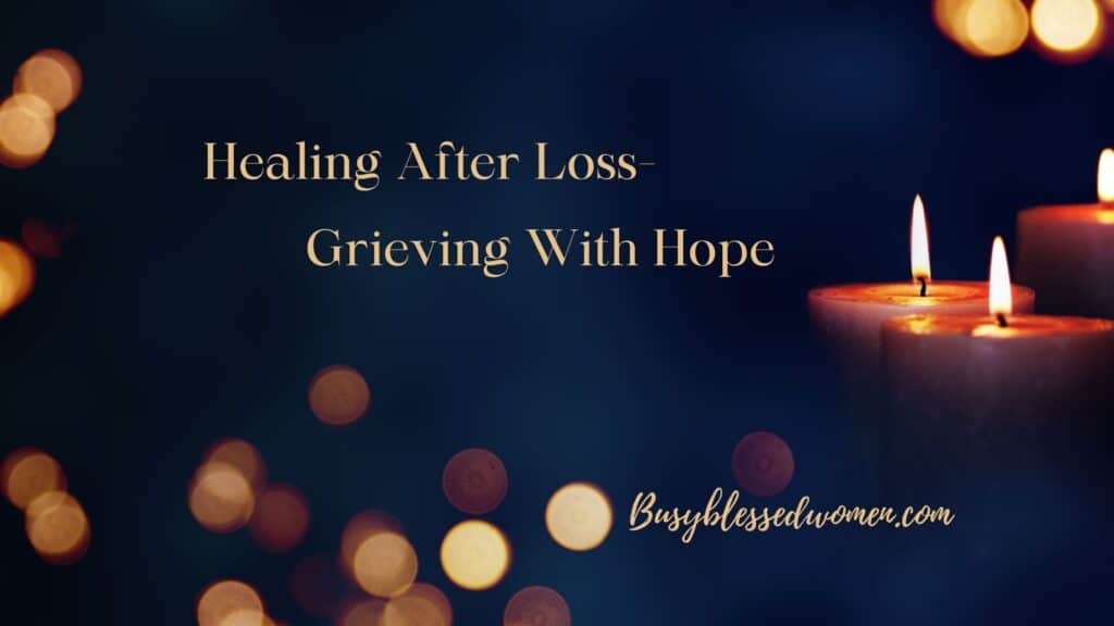 healing after loss- dark background with 3 short candles on right, small orbs of light scattered throughout